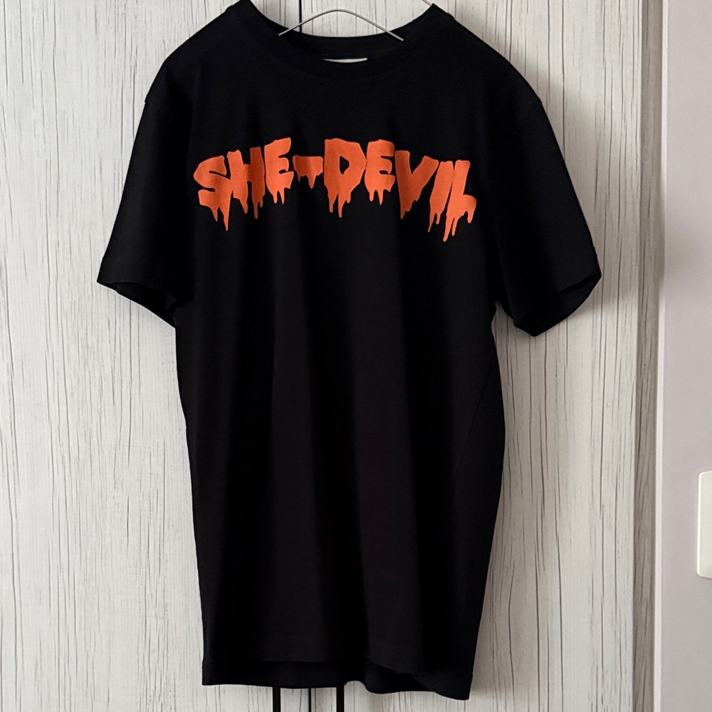 McQ by Alexander McQueen Black Tee with Orange 'SHE-DEVIL' Graphic